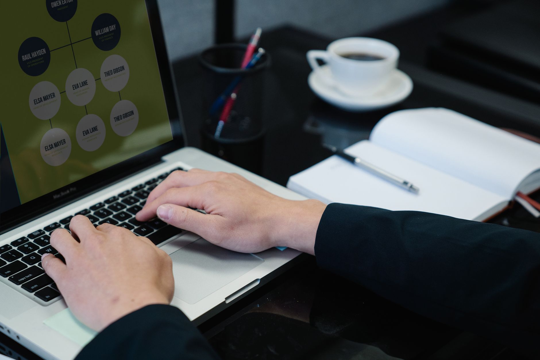 Person building a visual workflow on a laptop with connected nodes on screen