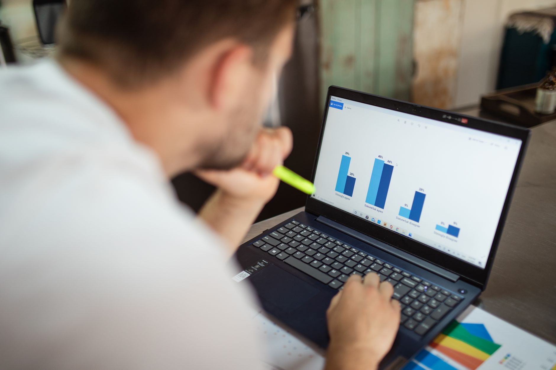 Laptop screen showing Google Sheets with colorful charts and AI side panel