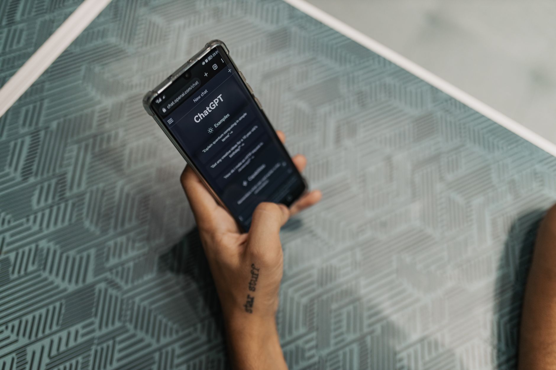 Person using smartphone with AI assistant app open on screen
