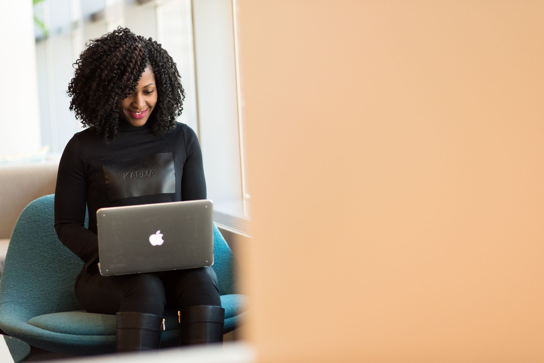 A person working on an email automation workflow on a laptop with a calm home office background.