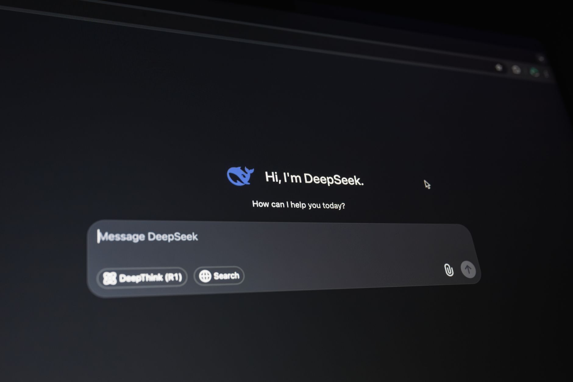 Person typing in ChatGPT interface on a laptop screen