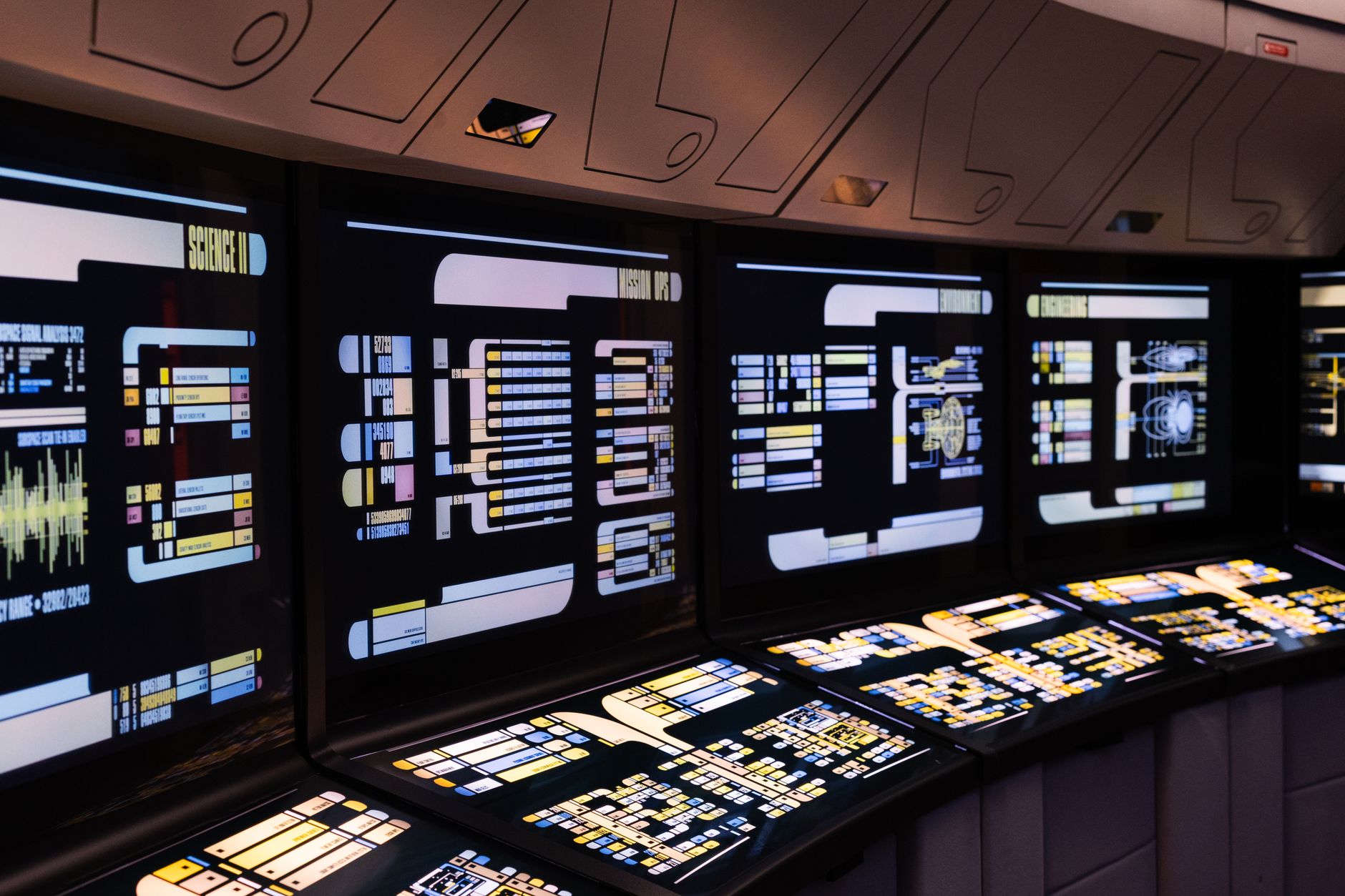 Dual monitors showing a visual workflow automation builder